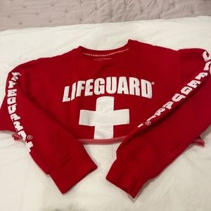 A cropped lifeguard sweatshirt